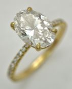 An IGI Certified 18K Yellow Gold, 3.04ct Lab Diamond Dress Ring. An oval cut diamond having F colour