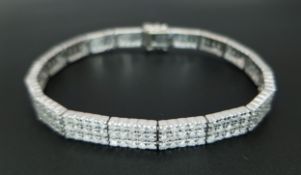 AN 18K WHITE GOLD, DIAMOND SET BRACELET. 5.00CTW DIAMONDS. 18CM LENGTH, 6MM WIDTH. 15G. SC 8060