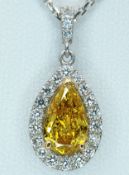 An 18K White Gold and Yellow Diamond Dress Pendant on an 18K Gold Chain. A 0.91ct yellow pear-cut