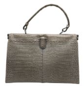 A Bottega Veneta Grey Handbag. Grey crocodile leather and Intrecciato leather exterior with silver-