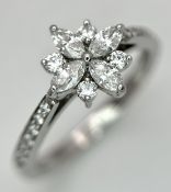A Head-Turning Tiffany and Co. Victoria Ring in Platinum and Diamonds. Marquise and round