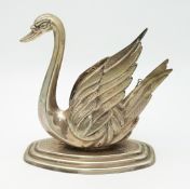 A BRANDY WARMER IN THE FORM OF A SWAN MADE IN WHITE METAL . 15cms x 14cms 290gms