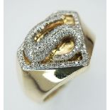 A 10K YELLOW GOLD, DIAMOND SET, SUPERMAN, INITIAL S RING. 8.8G, SIZE U. SC 8031