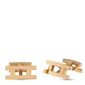 A pair of Hermes 18K Rose Gold Cufflinks. Crafted in 18K Rose Gold in the brand's pierced H motif