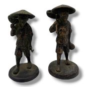 An antique Pair of Japanese bronze Fisherman Figures, with gilt highlights, modelled as fishermen