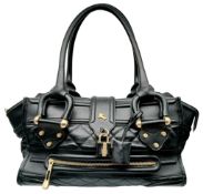 A Burberry Black Quilted Leather Manor Bag. Black leather exterior with diamond-quilted panels,
