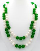 A Green Jade and Pearl Matinee Length Necklace. 8mm jade and 6/7mm pearls. 90cm necklace length.
