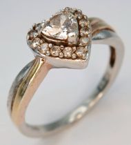 A Sparkling 925 Sterling Silver CZ Set Heart Ring - Size O 1/2. The ring is set with a central