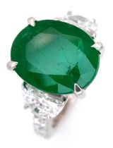 A Stunning 950 Platinum Natural Emerald and Diamond Cocktail Ring. Set with an oval cut 5.69ct