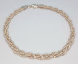 A Lovely 925 Sterling Silver Braided Chain Bracelet - 17cm length. The bracelet has an interwoven