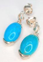 A Pretty Pair of 925 Sterling Silver Turquoise Set Drop Earrings - 2.2cm drop. Each earring is set
