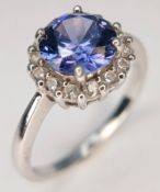 A pretty 925 Sterling Silver CZ Blue Stone Dress Ring. The ring is set with a round faceted blue