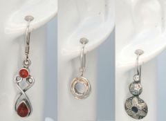 A Collection of Three Pairs of 925 Sterling Silver Drop Earrings. Including a pair of floral