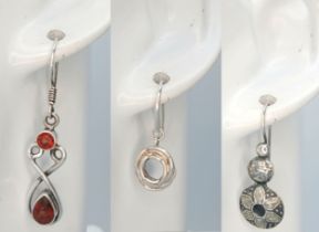 A Collection of Three Pairs of 925 Sterling Silver Drop Earrings. Including a pair of floral