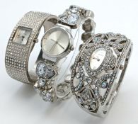 A Collection of Three Ladies Fashion Bangle Watches. Including a NEXT silver-tone crystal set bangle