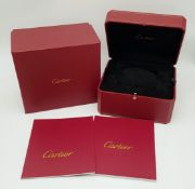 An Empty Cartier Watch Case. Red exterior with plush black interior. Comes with an outer box also.