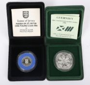 A 1986 Guernsey XIII Commonwealth Games silver coin (.500 silver and 28.28g), with a Jersey silver