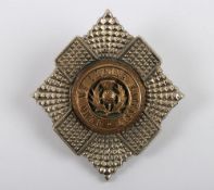 An Officer’s Silver, Gilt & Enamelled Cap Badge to the Royal Scots (The Royal Regiment).