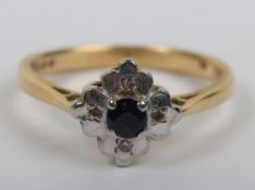 An 18ct sapphire chip diamond ring, 3.29g