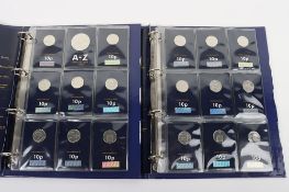 Two folders of Change Checker 10p coins, each containing twenty seven coins, (2 folders)