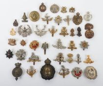Assortment of British Military Cap Badges. Included within this lot are examples of the Cornwall