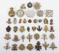 Collection of metal British Military Cap Badges. Items included within this lot are The East