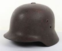 WW2 M38 Hungarian Helmet Shell. Solid relic helmet shell with some damage to top with loop to back.