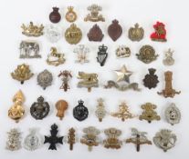 Assortment of British Military Cap Badges. Included within this lot are examples of the WW1 Welsh