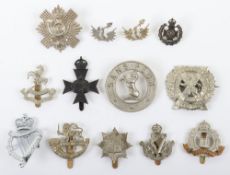 Grouping of British Territorial Battalion Cap Badges, including 8th (Irish) Battalion the King's