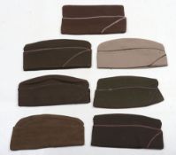 Grouping of American Military Garrison Caps, many with officers rank bars. Some with piping to the