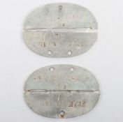 WW2 German ID Dog Tags. Two similar dog tags stamped ST.K.N.A.438 21 and other same but with 26 ,