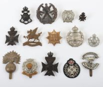 Grouping of British Territorial Infantry Cap & Collar Badges. Lot includes examples of the