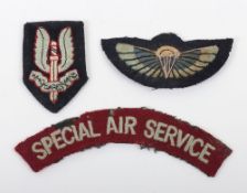 Small Collection of Post War Cloth Badges to the Special Air Service.Â Lot includes a Wing, Shoulder