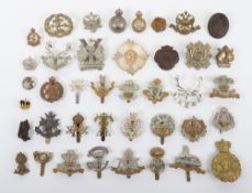 Selection of British Military Cap Badges. Items noted are The Essex Regiment, Hampshire Regiment &