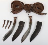Indian Gurkha Kukris. Two similar wood decorated hilt Kukri knives with 23 cm blade housed in