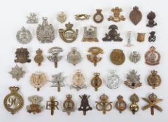 Grouping of British Military Cap Badges. Examples included are The King's own Scottish