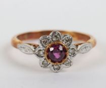 An 18ct gold and platinum ruby and diamond cluster ring,