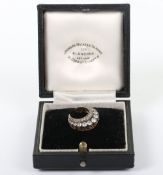 An unmarked yellow metal and diamond, Coronet brooch,