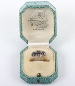 An 18ct gold, diamond and three stone sapphire ring,