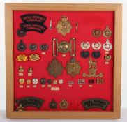 Framed Collection Of Badges to the Royal Marines.