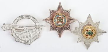 Two Silver, Gilt & Enamelled Irish Guards Cap Stars accompanied with a Tara Kilt Brooch.