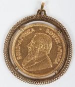 A Krugerrand, 1972, in 9ct surround,