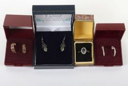 A pair of 9ct half hoop earrings (0.6g), a yellow and white metal ring marked (p)'lat'.