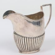An Early 20th century silver cream jug, William Hutton, Birmingham, 1910,
