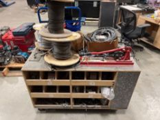 Assorted cable wire on rolling cart