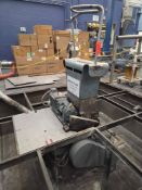 Scrap grinder with pull rolls