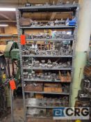 Asst press tooling includes die dishes, tool hold downs, tool holders and misc tooling