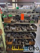 Asst press tooling includes die dishes, tool hold downs, tool holders and misc tooling