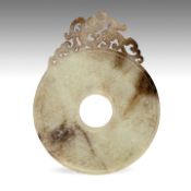 A Chinese celadon jade 'Chilong' bi disc, late Warring States period to early Western Han dynasty, L