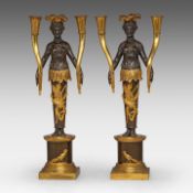 A pair of Empire gilt and patinated bronze figural candlesticks with an allegory of America 42 cm. (